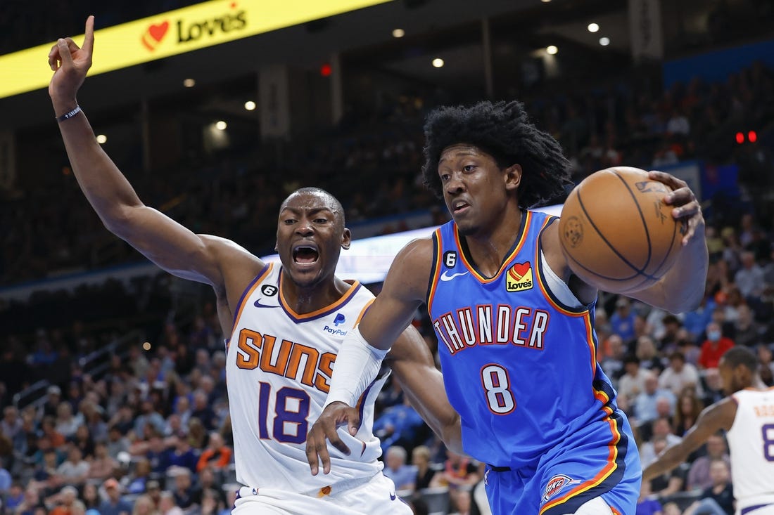 Apr 2, 2023; Oklahoma City, Oklahoma, USA; Oklahoma City Thunder forward Jalen Williams (8) drives to the basket against Phoenix Suns center Bismack Biyombo (18) during the second quarter at Paycom Center. Mandatory Credit: Alonzo Adams-USA TODAY Sports