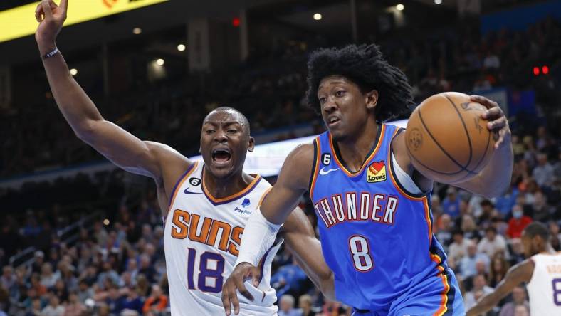 Apr 2, 2023; Oklahoma City, Oklahoma, USA; Oklahoma City Thunder forward Jalen Williams (8) drives to the basket against Phoenix Suns center Bismack Biyombo (18) during the second quarter at Paycom Center. Mandatory Credit: Alonzo Adams-USA TODAY Sports