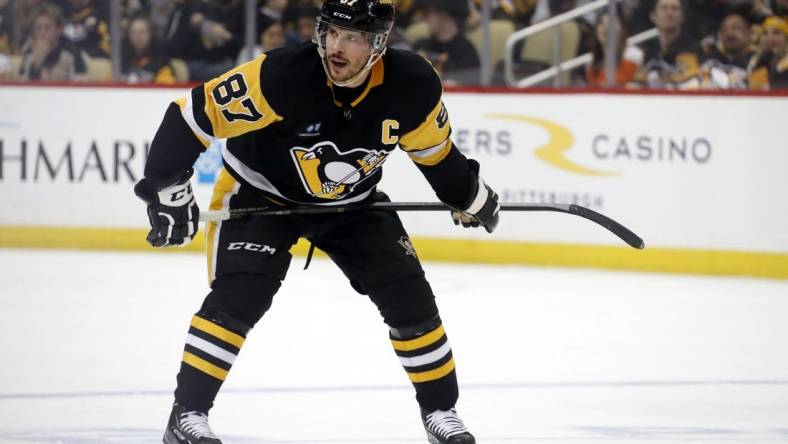 Apr 2, 2023; Pittsburgh, Pennsylvania, USA;  Pittsburgh Penguins center Sidney Crosby (87) prepares to take a face-off against the Philadelphia Flyers during the third period at PPG Paints Arena. The Penguins won 4-2. Mandatory Credit: Charles LeClaire-USA TODAY Sports