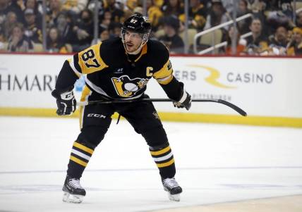 Apr 2, 2023; Pittsburgh, Pennsylvania, USA;  Pittsburgh Penguins center Sidney Crosby (87) prepares to take a face-off against the Philadelphia Flyers during the third period at PPG Paints Arena. The Penguins won 4-2. Mandatory Credit: Charles LeClaire-USA TODAY Sports