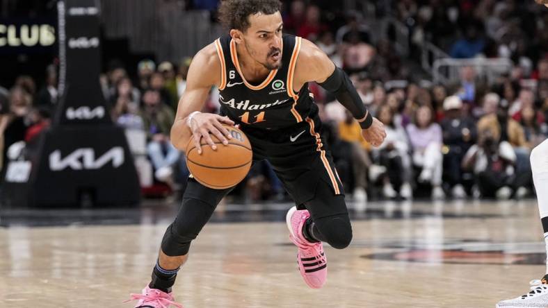 Apr 2, 2023; Atlanta, Georgia, USA; Atlanta Hawks guard Trae Young (11) dribbles against the Dallas Mavericks during the second half at State Farm Arena. Mandatory Credit: Dale Zanine-USA TODAY Sports