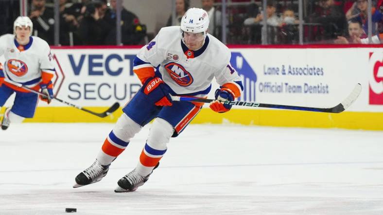 Apr 2, 2023; Raleigh, North Carolina, USA;  New York Islanders center Bo Horvat (14) skates with the puck against the Carolina Hurricanes during the second period at PNC Arena. Mandatory Credit: James Guillory-USA TODAY Sports