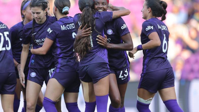 Apr 2, 2023; Orlando, Florida, USA; Orlando Pride forward Messiah Bright (23) celebrates a goal with teammates in the second half against Angel City FC at Exploria Stadium. Mandatory Credit: Cory Knowlton-USA TODAY Sports