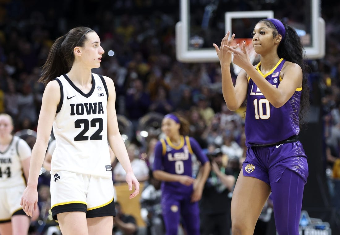 Apr 2, 2023; Dallas, TX, USA; LSU Lady Tigers forward Angel Reese (10) gestures to Iowa Hawkeyes guard Caitlin Clark (22) after the game during the final round of the Women's Final Four NCAA tournament at the American Airlines Center. Mandatory Credit: Kevin Jairaj-USA TODAY Sports