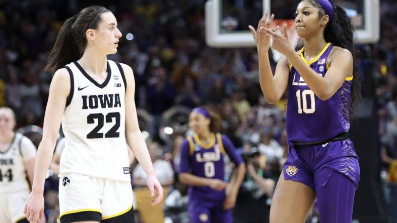 Apr 2, 2023; Dallas, TX, USA; LSU Lady Tigers forward Angel Reese (10) gestures to Iowa Hawkeyes guard Caitlin Clark (22) after the game during the final round of the Women's Final Four NCAA tournament at the American Airlines Center. Mandatory Credit: Kevin Jairaj-USA TODAY Sports