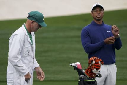 Apr 3, 2023; Augusta, Georgia, USA; Tiger Woods warms up on the practice range alongside caddie Joe LaCava during a practice round for The Masters golf tournament at Augusta National Golf Club. Mandatory Credit: Katie Goodale-USA TODAY Network

Pga The Masters Practice Round