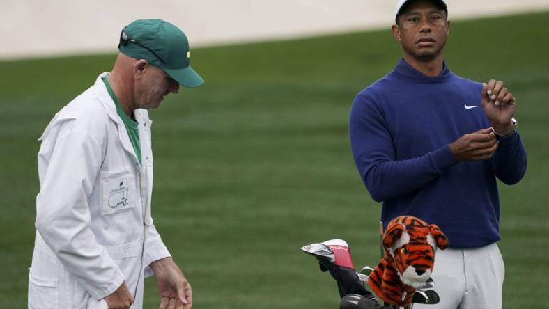 Apr 3, 2023; Augusta, Georgia, USA; Tiger Woods warms up on the practice range alongside caddie Joe LaCava during a practice round for The Masters golf tournament at Augusta National Golf Club. Mandatory Credit: Katie Goodale-USA TODAY Network

Pga The Masters Practice Round