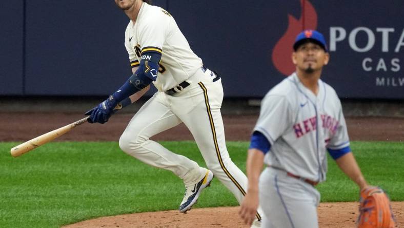 Apr 3, 2023; Milwaukee, Wisconsin, USA; Milwaukee Brewers third baseman Brian Anderson (9) hits a two-run home run off of New York Mets starting pitcher Carlos Carrasco (59) during the fourth inning of their game at American Family Field. Mandatory Credit: Mark Hoffman/Milwaukee Journal Sentinel-USA TODAY Sports