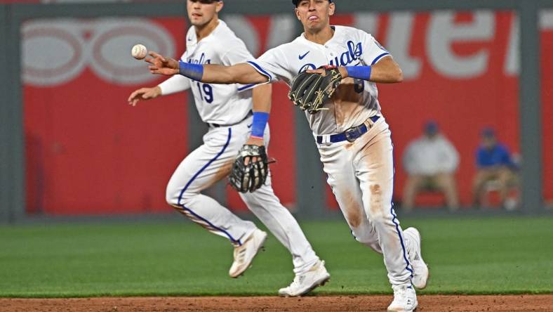 Apr 3, 2023; Kansas City, Missouri, USA;  Kansas City Royals shortstop Nicky Lopez (8) throws to first base for an out during the fifth inning against the Toronto Blue Jays at Kauffman Stadium. Mandatory Credit: Peter Aiken-USA TODAY Sports