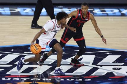 Apr 3, 2023; Houston, TX, USA; Connecticut Huskies guard Tristen Newton (2) shoots the ball as San Diego State Aztecs guard Micah Parrish (3) defends during the first half in the national championship game of the 2023 NCAA Tournament at NRG Stadium. Mandatory Credit: Troy Taormina-USA TODAY Sports