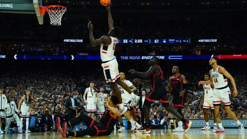 Apr 3, 2023; Houston, TX, USA; Connecticut Huskies forward Adama Sanogo (21) shoots against the San Diego State Aztecs in the national championship game of the 2023 NCAA Tournament at NRG Stadium. Mandatory Credit: Robert Deutsch-USA TODAY Sports