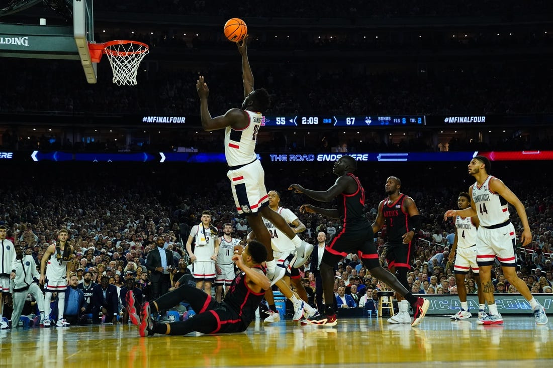 Apr 3, 2023; Houston, TX, USA; Connecticut Huskies forward Adama Sanogo (21) shoots against the San Diego State Aztecs in the national championship game of the 2023 NCAA Tournament at NRG Stadium. Mandatory Credit: Robert Deutsch-USA TODAY Sports
