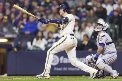 Apr 4, 2023; Milwaukee, Wisconsin, USA;  Milwaukee Brewers third baseman Brian Anderson (9) hits a home run during the sixth inning against the New York Mets at American Family Field. Mandatory Credit: Jeff Hanisch-USA TODAY Sports
