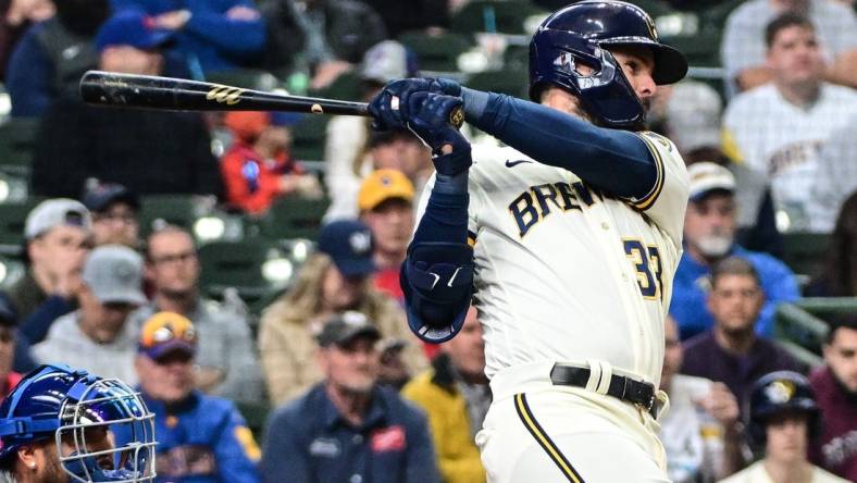 Apr 5, 2023; Milwaukee, Wisconsin, USA; Milwaukee Brewers designated hitter Jesse Winker (33) hits a double to drive in two runs in the fifth inning against the New York Mets at American Family Field. Mandatory Credit: Benny Sieu-USA TODAY Sports