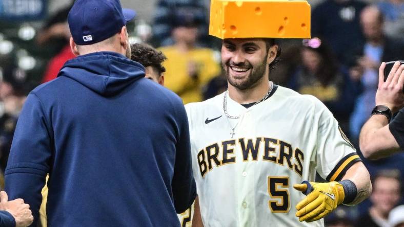 Apr 5, 2023; Milwaukee, Wisconsin, USA;  Milwaukee Brewers left fielder Garrett Mitchell (5) celebrates after hitting a walkout home run in the ninth inning against the New York Mets at American Family Field. Mandatory Credit: Benny Sieu-USA TODAY Sports