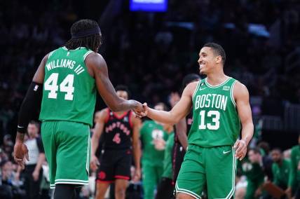 Apr 5, 2023; Boston, Massachusetts, USA; Boston Celtics guard Malcolm Brogdon (13) reacts after his three point basket with center Robert Williams III (44) against the Toronto Raptors in the second quarter at TD Garden. Mandatory Credit: David Butler II-USA TODAY Sports