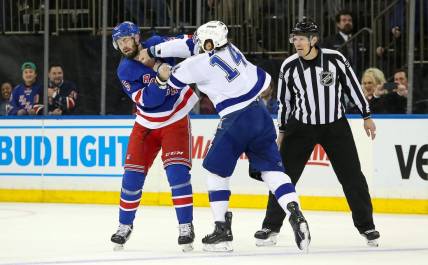 Apr 5, 2023; New York, New York, USA; New York Rangers defenseman Ben Harpur (5) fights Tampa Bay Lightning left wing Pat Maroon (14) during the first period at Madison Square Garden. Mandatory Credit: Danny Wild-USA TODAY Sports