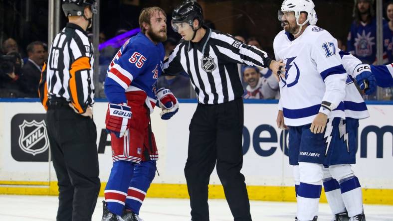 Apr 5, 2023; New York, New York, USA; New York Rangers defenseman Ryan Lindgren (55) and Tampa Bay Lightning left wing Alex Killorn (17) are separated after fighting during the second period at Madison Square Garden. Mandatory Credit: Danny Wild-USA TODAY Sports