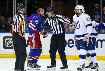 Apr 5, 2023; New York, New York, USA; New York Rangers defenseman Ryan Lindgren (55) and Tampa Bay Lightning left wing Alex Killorn (17) are separated after fighting during the second period at Madison Square Garden. Mandatory Credit: Danny Wild-USA TODAY Sports