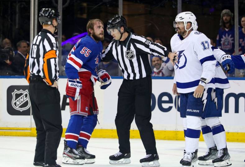 Apr 5, 2023; New York, New York, USA; New York Rangers defenseman Ryan Lindgren (55) and Tampa Bay Lightning left wing Alex Killorn (17) are separated after fighting during the second period at Madison Square Garden. Mandatory Credit: Danny Wild-USA TODAY Sports