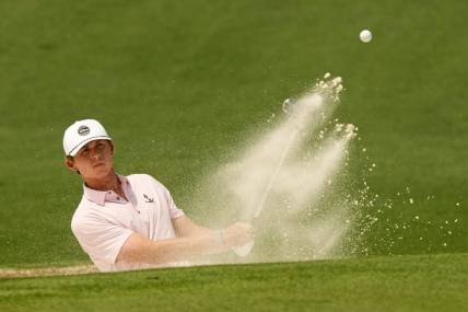 Apr 6, 2023; Augusta, Georgia, USA; Gordon Sargent plays a shot from a bunker on the second hole during the first round of The Masters golf tournament. Mandatory Credit: Michael Madrid-USA TODAY Network