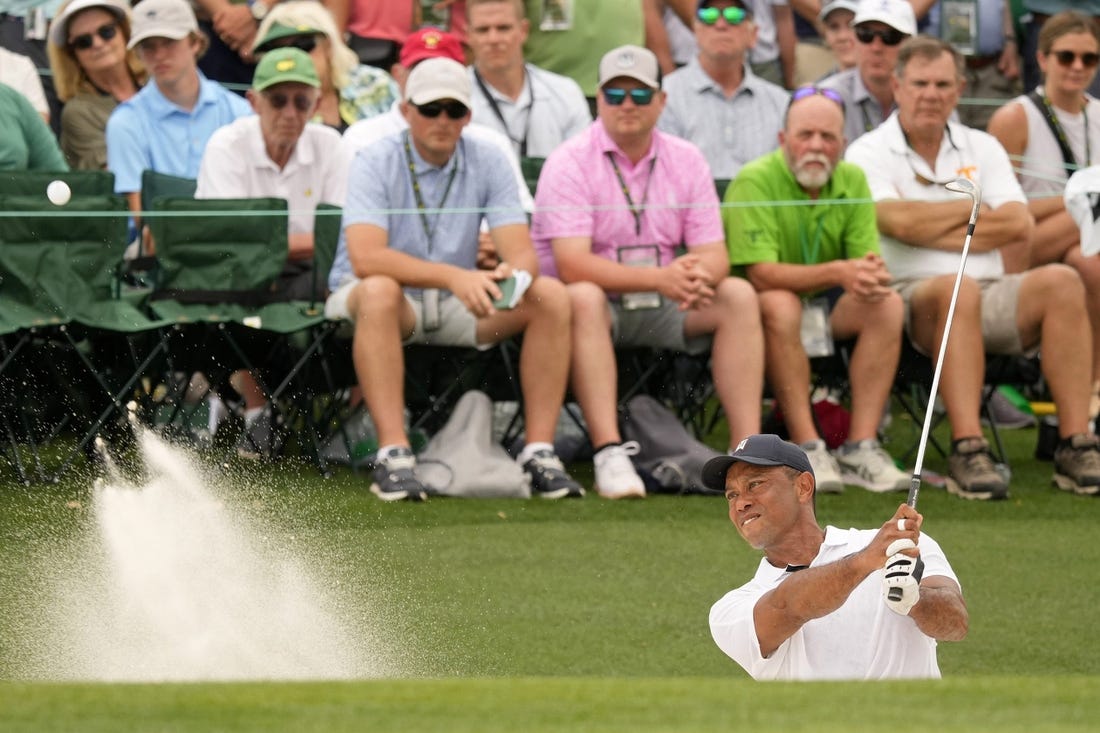 Apr 6, 2023; Augusta, Georgia, USA; Tiger Woods plays a shot from a bunker on the 18th hole during the first round of The Masters golf tournament. Mandatory Credit: Michael Madrid-USA TODAY Network

Pga Masters Tournament First Round