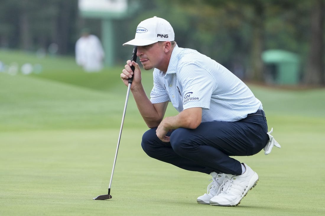 Apr 6, 2023; Augusta, Georgia, USA; Sam Bennett lines up his putt on the eighth green during the first round of The Masters golf tournament. Mandatory Credit: Danielle Parhizkaran-USA TODAY Network