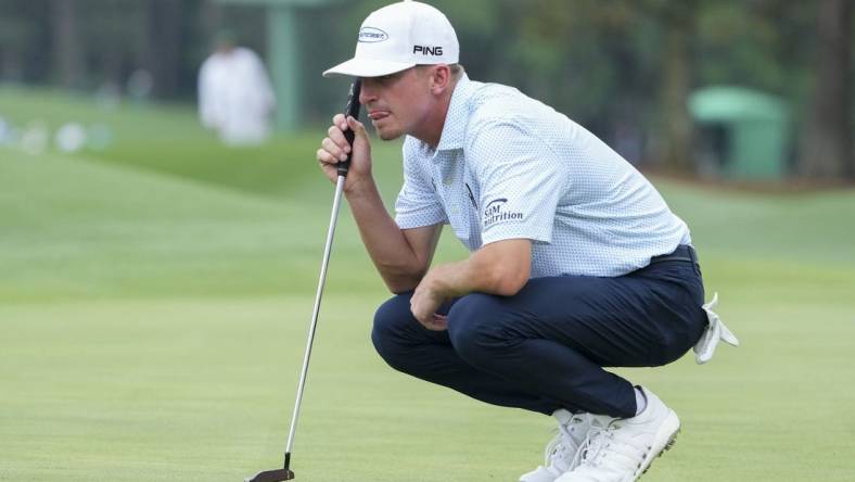 Apr 6, 2023; Augusta, Georgia, USA; Sam Bennett lines up his putt on the eighth green during the first round of The Masters golf tournament. Mandatory Credit: Danielle Parhizkaran-USA TODAY Network