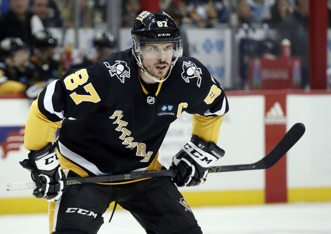 Apr 6, 2023; Pittsburgh, Pennsylvania, USA; Pittsburgh Penguins center Sidney Crosby (87) looks on before taking a face-off against the Minnesota Wild during the second period at PPG Paints Arena. Mandatory Credit: Charles LeClaire-USA TODAY Sports