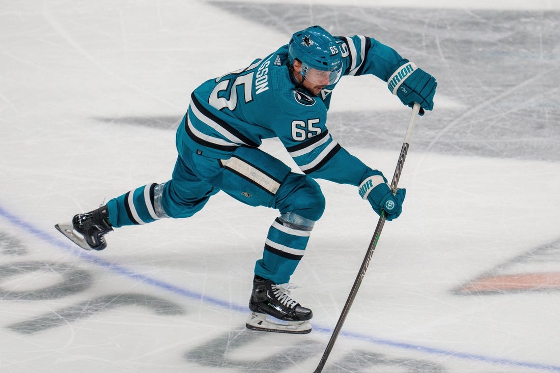 Apr 6, 2023; San Jose, California, USA; San Jose Sharks defenseman Erik Karlsson (65) shoots the puck against the Colorado Avalanche during the third period at SAP Center at San Jose. Mandatory Credit: Neville E. Guard-USA TODAY Sports