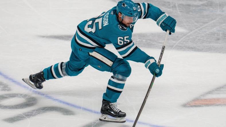 Apr 6, 2023; San Jose, California, USA; San Jose Sharks defenseman Erik Karlsson (65) shoots the puck against the Colorado Avalanche during the third period at SAP Center at San Jose. Mandatory Credit: Neville E. Guard-USA TODAY Sports