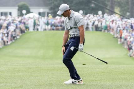 Apr 7, 2023; Augusta, Georgia, USA; Rory McIlroy reacts to his shot after hitting from the first fairway during the second round of The Masters golf tournament. Mandatory Credit: Rob Schumacher-USA TODAY Network