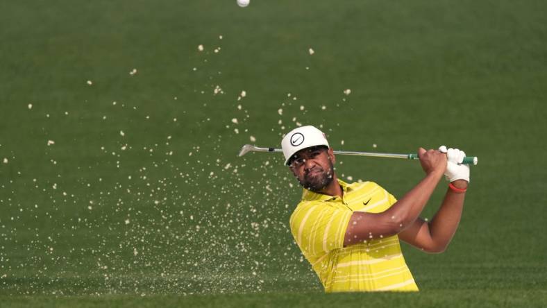 Apr 7, 2023; Augusta, Georgia, USA; Tony Finau plays a shot from a bunker on the second hole during the second round of The Masters golf tournament. Mandatory Credit: Michael Madrid-USA TODAY Network