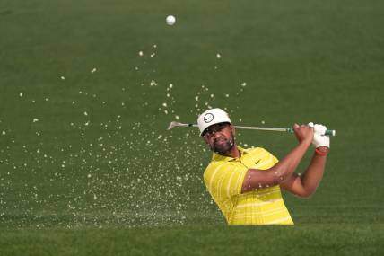Apr 7, 2023; Augusta, Georgia, USA; Tony Finau plays a shot from a bunker on the second hole during the second round of The Masters golf tournament. Mandatory Credit: Michael Madrid-USA TODAY Network