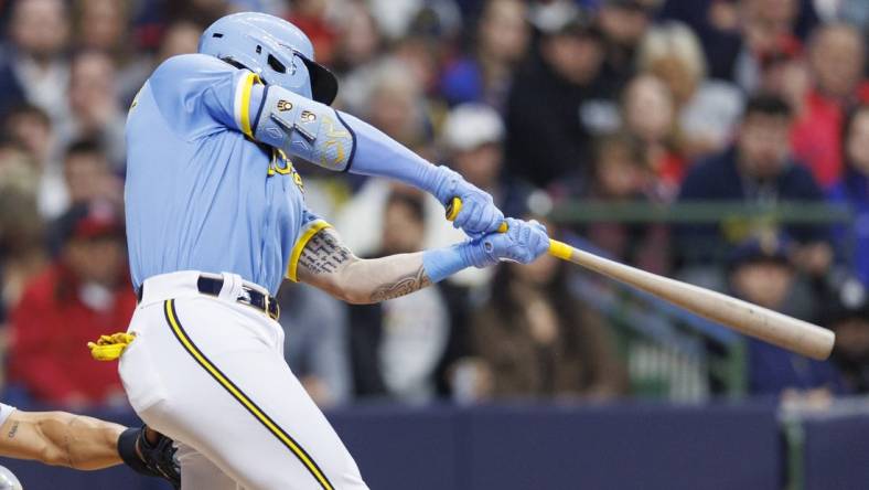 Apr 7, 2023; Milwaukee, Wisconsin, USA;  Milwaukee Brewers center fielder Garrett Mitchell (5) this an RBI single during the third inning against the St. Louis Cardinals at American Family Field. Mandatory Credit: Jeff Hanisch-USA TODAY Sports