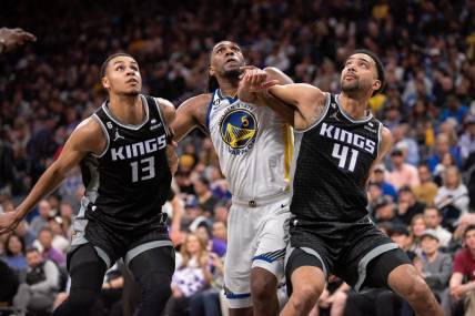 Apr 7, 2023; Sacramento, California, USA; Sacramento Kings forward Keegan Murray (13) and forward Trey Lyles (41) fight for position under the basket with Golden State Warriors forward Kevon Looney (5) during the third quarter at Golden 1 Center. Mandatory Credit: Ed Szczepanski-USA TODAY Sports