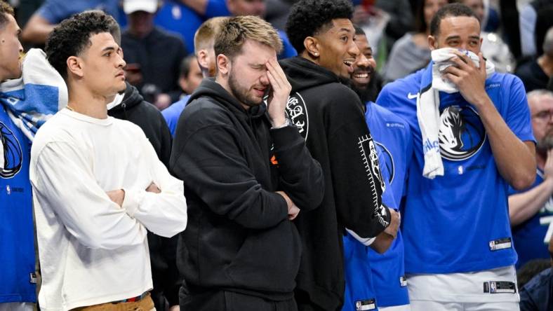 Apr 7, 2023; Dallas, Texas, USA; Dallas Mavericks guard Josh Green (8) and guard Luka Doncic (77) and forward Christian Wood (35) and forward Markieff Morris (13) and center JaVale McGee (00) watch the game between the Dallas Mavericks and the Chicago Bulls during the second half at the American Airlines Center. Mandatory Credit: Jerome Miron-USA TODAY Sports