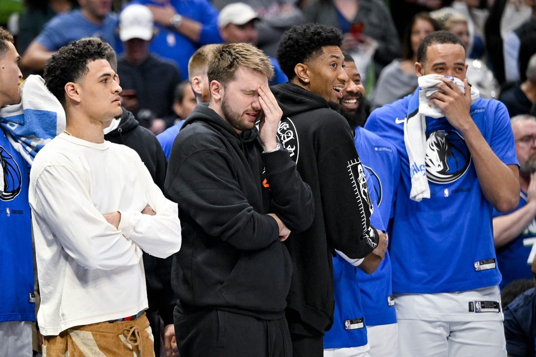 Apr 7, 2023; Dallas, Texas, USA; Dallas Mavericks guard Josh Green (8) and guard Luka Doncic (77) and forward Christian Wood (35) and forward Markieff Morris (13) and center JaVale McGee (00) watch the game between the Dallas Mavericks and the Chicago Bulls during the second half at the American Airlines Center. Mandatory Credit: Jerome Miron-USA TODAY Sports