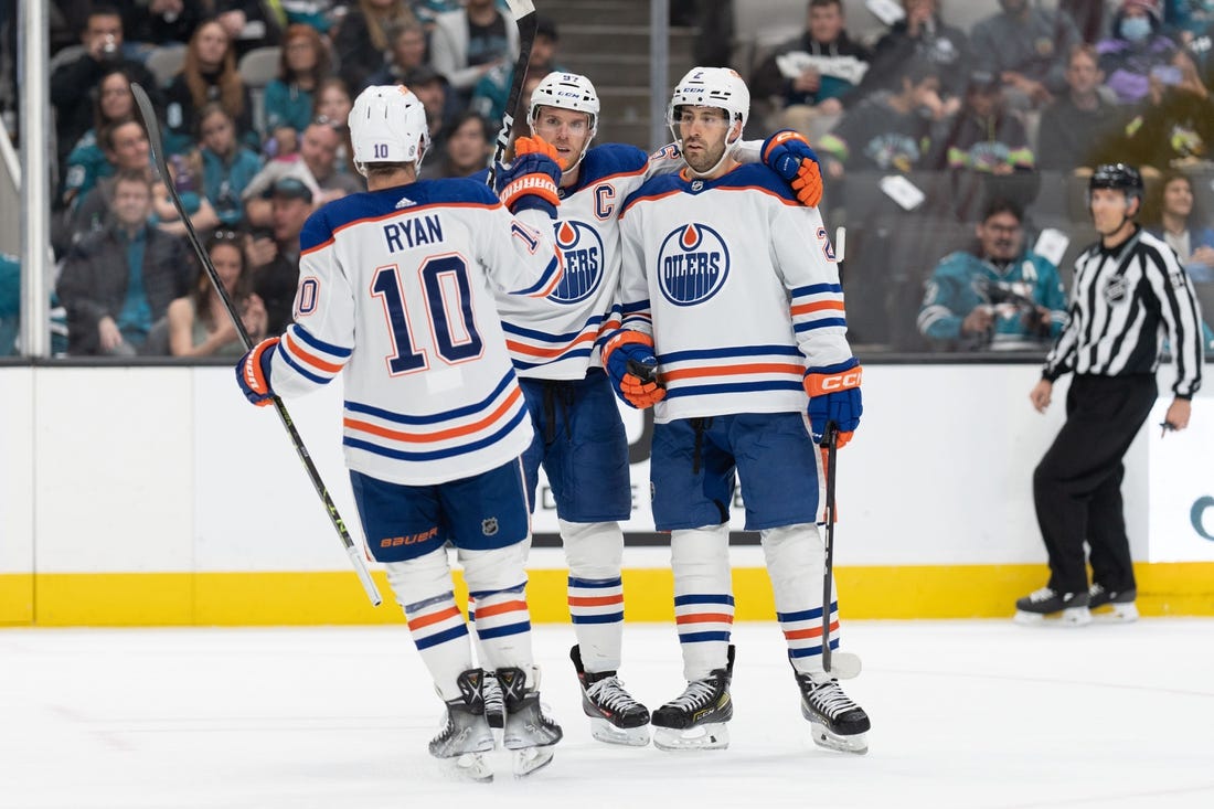 Apr 8, 2023; San Jose, California, USA;  Edmonton Oilers center Derek Ryan (10) celebrates with center Connor McDavid (97) and defenseman Evan Bouchard (2) during the first period against the San Jose Sharks at SAP Center at San Jose. Mandatory Credit: Stan Szeto-USA TODAY Sports