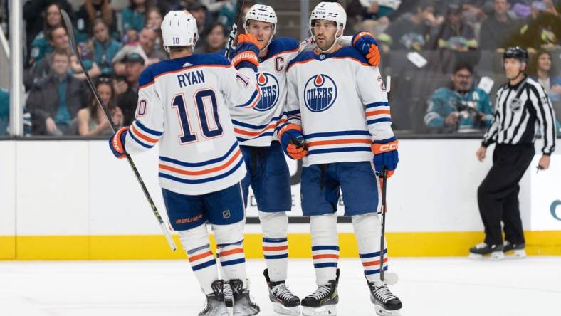 Apr 8, 2023; San Jose, California, USA;  Edmonton Oilers center Derek Ryan (10) celebrates with center Connor McDavid (97) and defenseman Evan Bouchard (2) during the first period against the San Jose Sharks at SAP Center at San Jose. Mandatory Credit: Stan Szeto-USA TODAY Sports