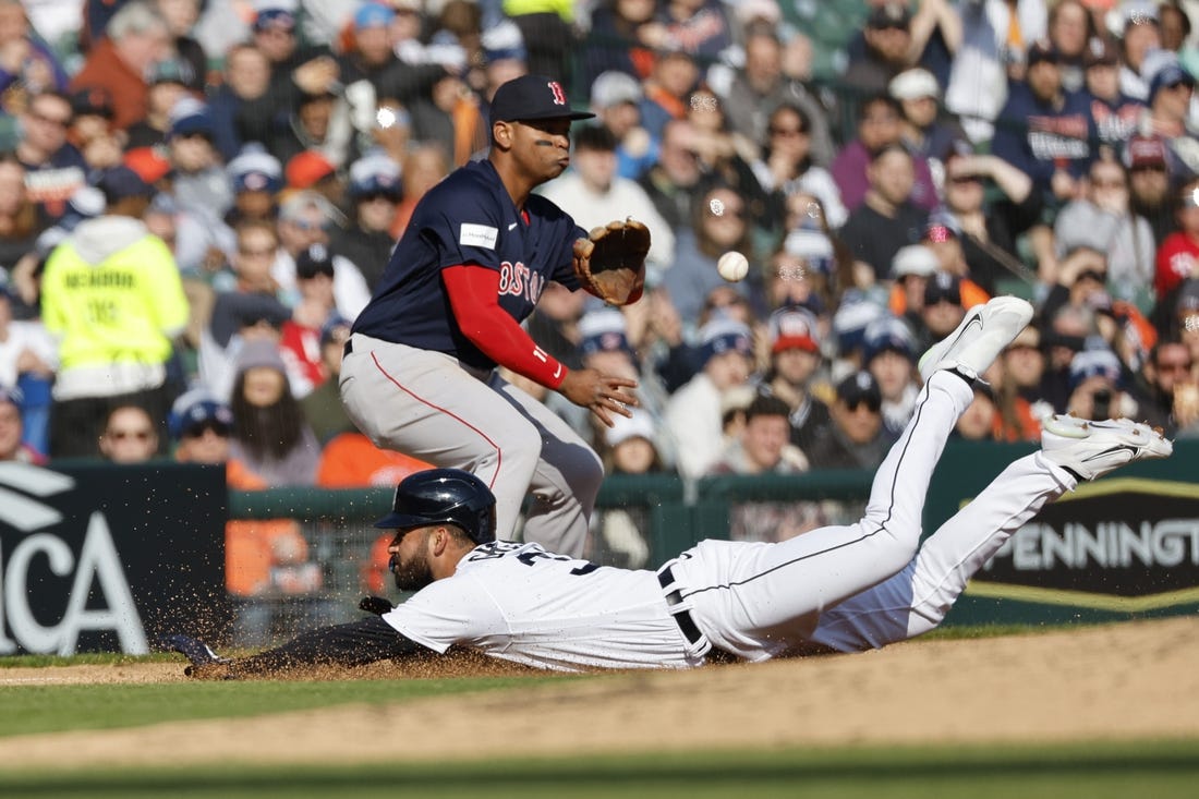 Apr 8, 2023; Detroit, Michigan, USA;  Detroit Tigers center fielder Riley Greene (31) dives in safe at third ahead of the throw to third baseman Rafael Devers (11) in the fourth inning at Comerica Park. Mandatory Credit: Rick Osentoski-USA TODAY Sports