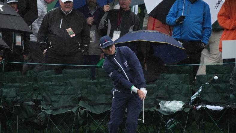 Apr 8, 2023; Augusta, Georgia, USA; Zach Johnson chips onto the 18th green during the third round of The Masters golf tournament. Mandatory Credit: Kyle Terada-USA TODAY Network