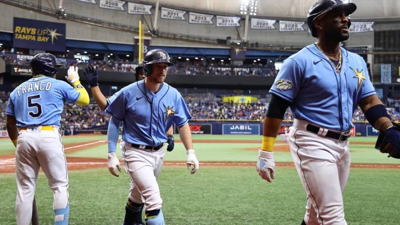 Apr 8, 2023; St. Petersburg, Florida, USA; Tampa Bay Rays second baseman Brandon Lowe (8) is congratulated after hitting a 3-run home run against the Oakland Athletics during the sixth inning at Tropicana Field. Mandatory Credit: Kim Klement-USA TODAY Sports