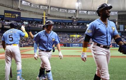 Apr 8, 2023; St. Petersburg, Florida, USA; Tampa Bay Rays second baseman Brandon Lowe (8) is congratulated after hitting a 3-run home run against the Oakland Athletics during the sixth inning at Tropicana Field. Mandatory Credit: Kim Klement-USA TODAY Sports