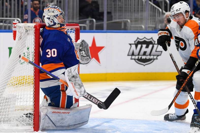 Apr 8, 2023; Elmont, New York, USA;  New York Islanders goaltender Ilya Sorokin (30) makes a save against the Philadelphia Flyers during the first period at UBS Arena. Mandatory Credit: Dennis Schneidler-USA TODAY Sports