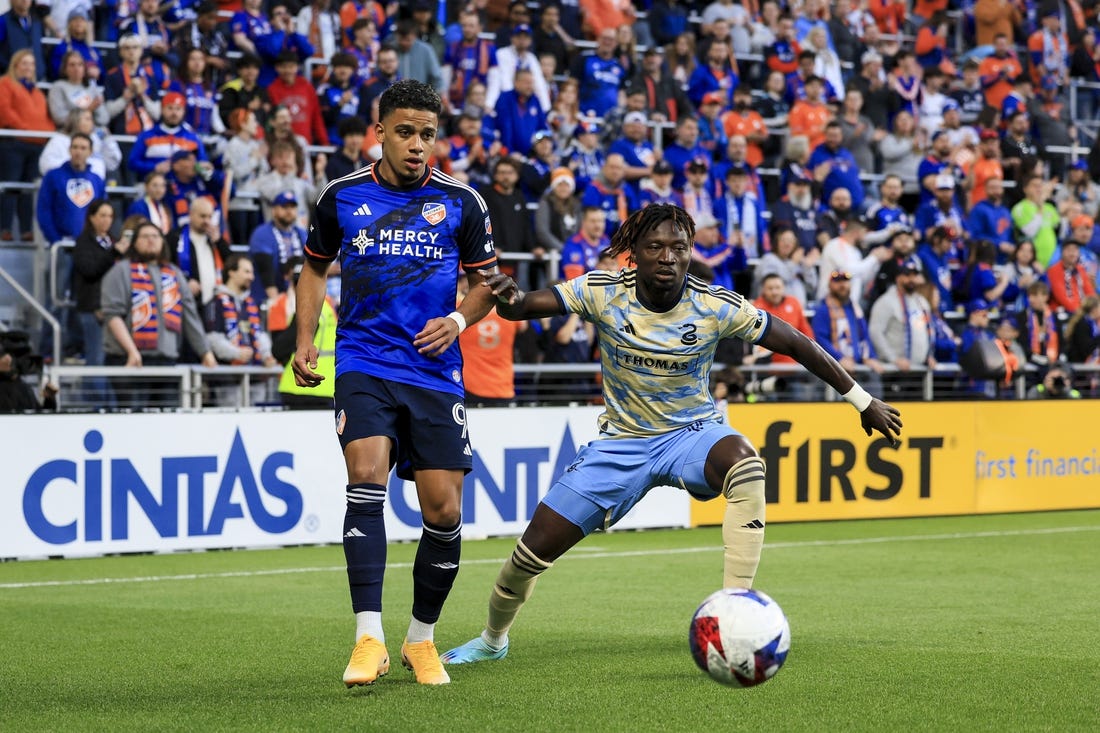 Apr 8, 2023; Cincinnati, Ohio, USA;  FC Cincinnati forward Brenner (9) passes the ball against Philadelphia Union defender Olivier Mbaizo (15) in the first half at TQL Stadium. Mandatory Credit: Aaron Doster-USA TODAY Sports