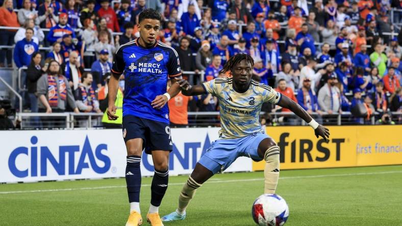 Apr 8, 2023; Cincinnati, Ohio, USA;  FC Cincinnati forward Brenner (9) passes the ball against Philadelphia Union defender Olivier Mbaizo (15) in the first half at TQL Stadium. Mandatory Credit: Aaron Doster-USA TODAY Sports