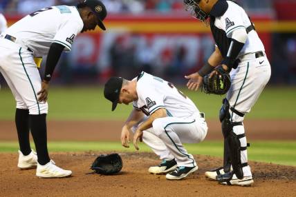 Apr 8, 2023; Phoenix, Arizona, USA; Arizona Diamondbacks pitcher Zach Davies reacts after suffering an injury in the fifth inning against the Los Angeles Dodgers at Chase Field. Mandatory Credit: Mark J. Rebilas-USA TODAY Sports