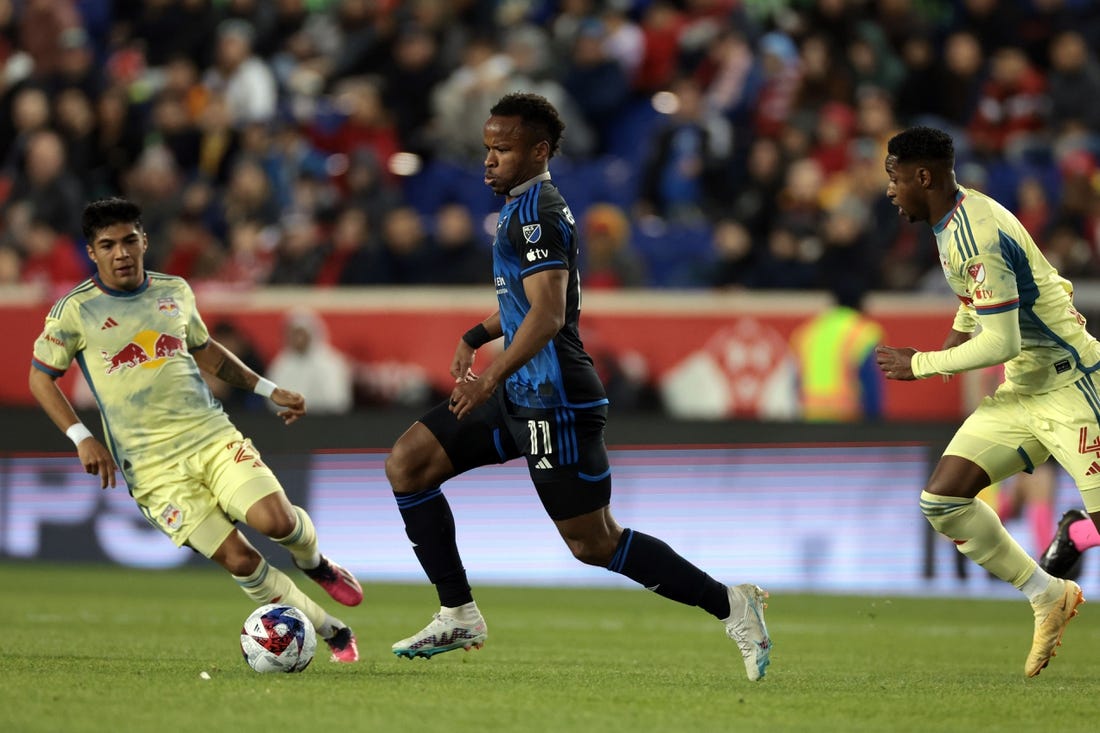 Apr 8, 2023; Harrison, New Jersey, USA;  San Jose Earthquakes forward Jeremy Ebobisse (11) controls the ball against New York Red Bulls midfielder Omir Fernandez (21) nd defender Andres Reyes (4) in the first half against the New York Red Bulls at Red Bull Arena. Mandatory Credit: Vincent Carchietta-USA TODAY Sports