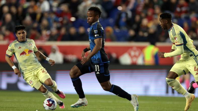 Apr 8, 2023; Harrison, New Jersey, USA;  San Jose Earthquakes forward Jeremy Ebobisse (11) controls the ball against New York Red Bulls midfielder Omir Fernandez (21) nd defender Andres Reyes (4) in the first half against the New York Red Bulls at Red Bull Arena. Mandatory Credit: Vincent Carchietta-USA TODAY Sports